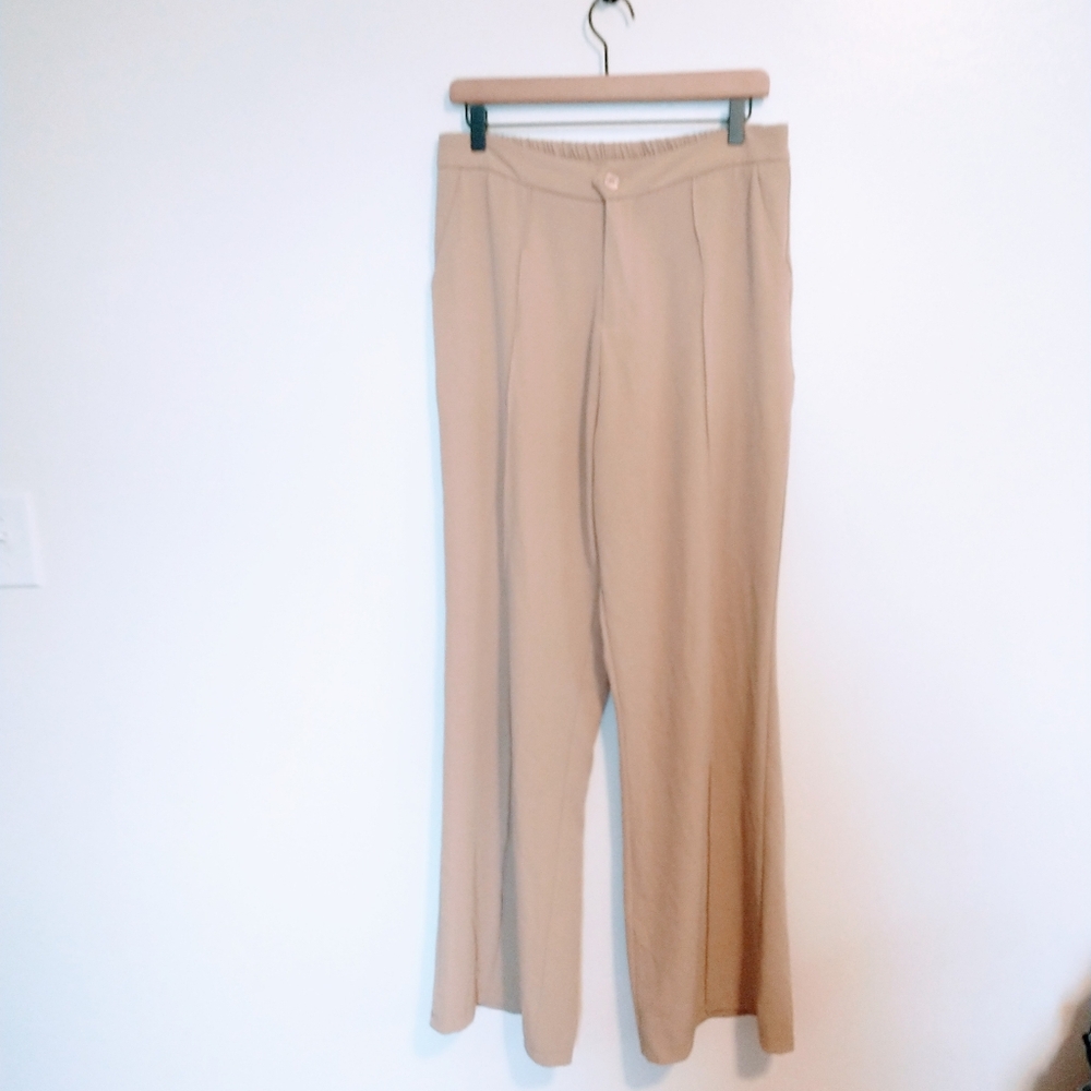 Tan high waisted stretchy dress pants with front button and pockets! Size 12, fi